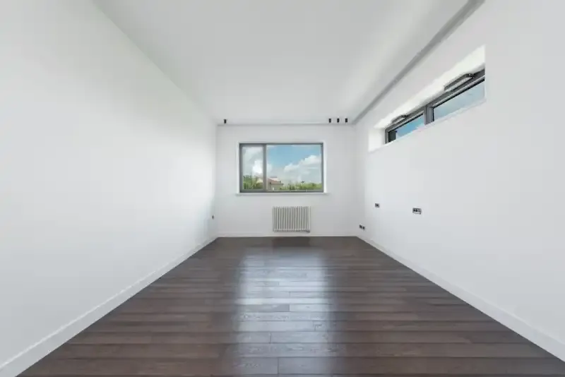 Apartment buyer conducting a pre-settlement inspection checking fixtures and finishes