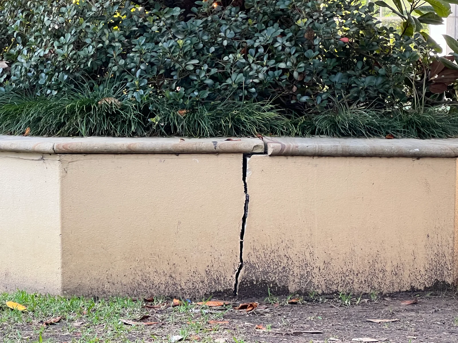 Full height vertical crack through a rendered masonry wall, photographed during an Owner Inspections site assessment