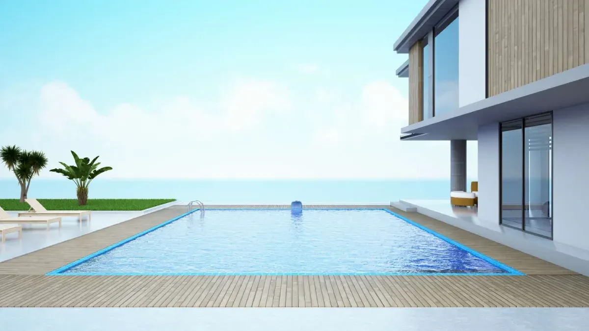 Swimming pool showing visible surface cracks and staining requiring inspection