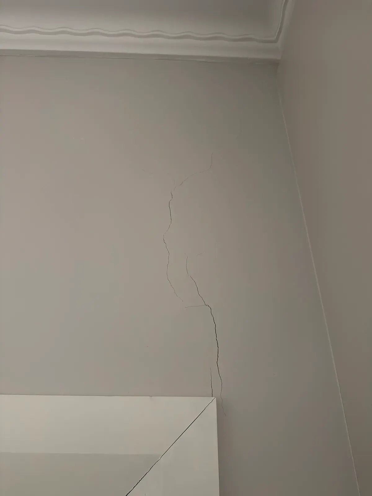 Plaster crack running from the top corner of a door opening, recorded during a property inspection in Concord NSW