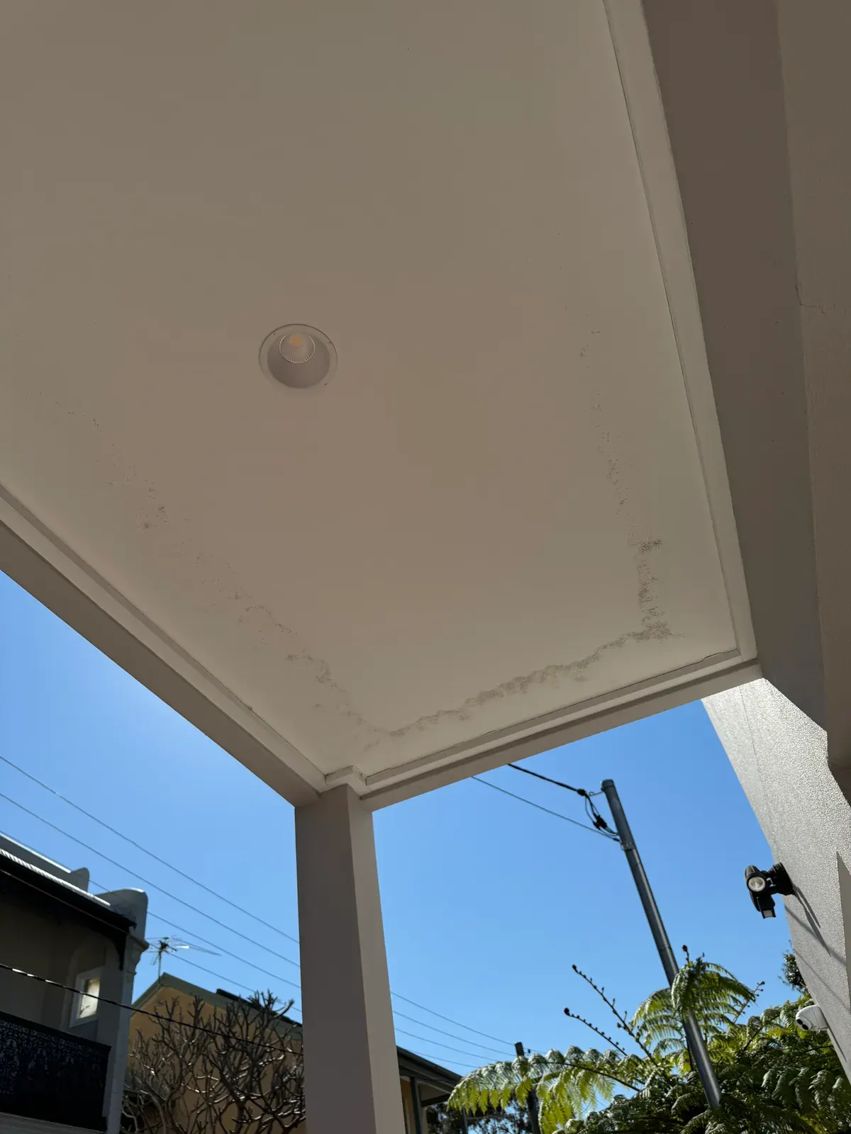 Mould and moisture staining along a verandah ceiling lining, recorded during a property inspection in Balmain NSW