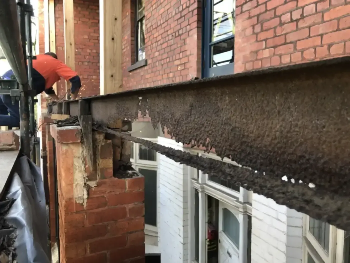 Corroded metal beam showing construction defect