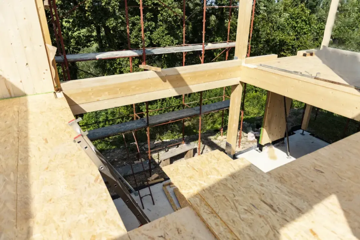 Building inspector documenting construction defects on a building site