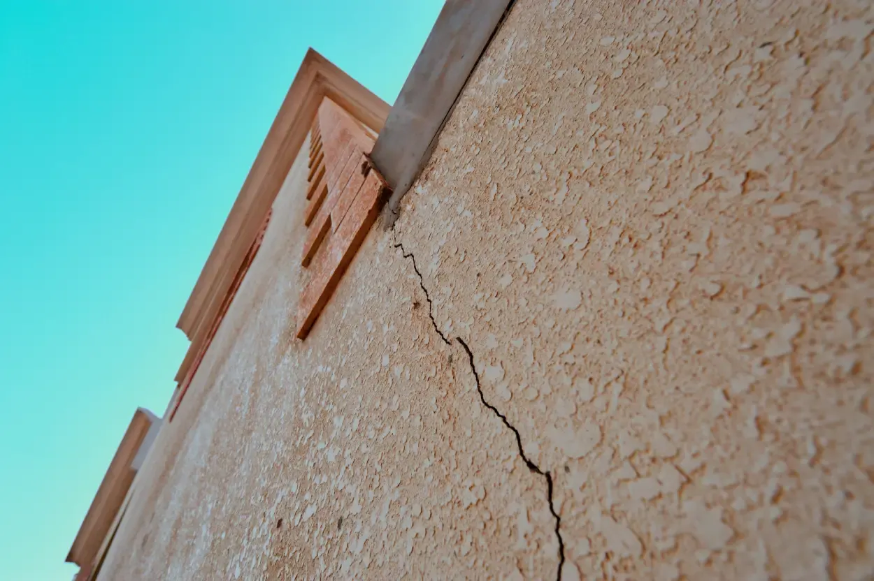 Building inspector conducting a dilapidation survey on a neighbouring property before construction in Australia