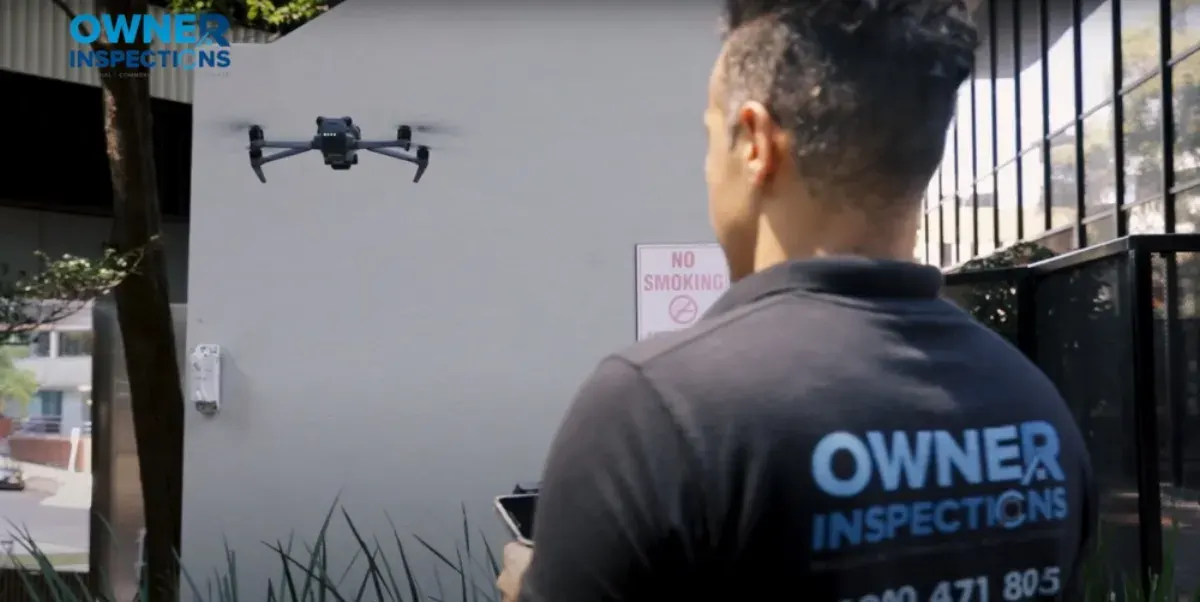 Split view comparing a drone inspecting a roof and a tradesperson on a ladder performing a manual roof inspection