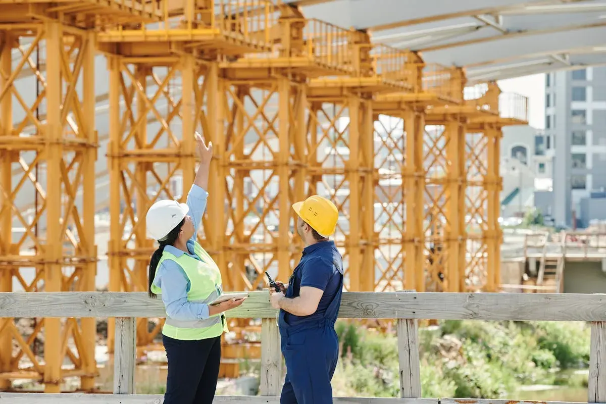 Construction expert witness reviewing building plans at a dispute hearing