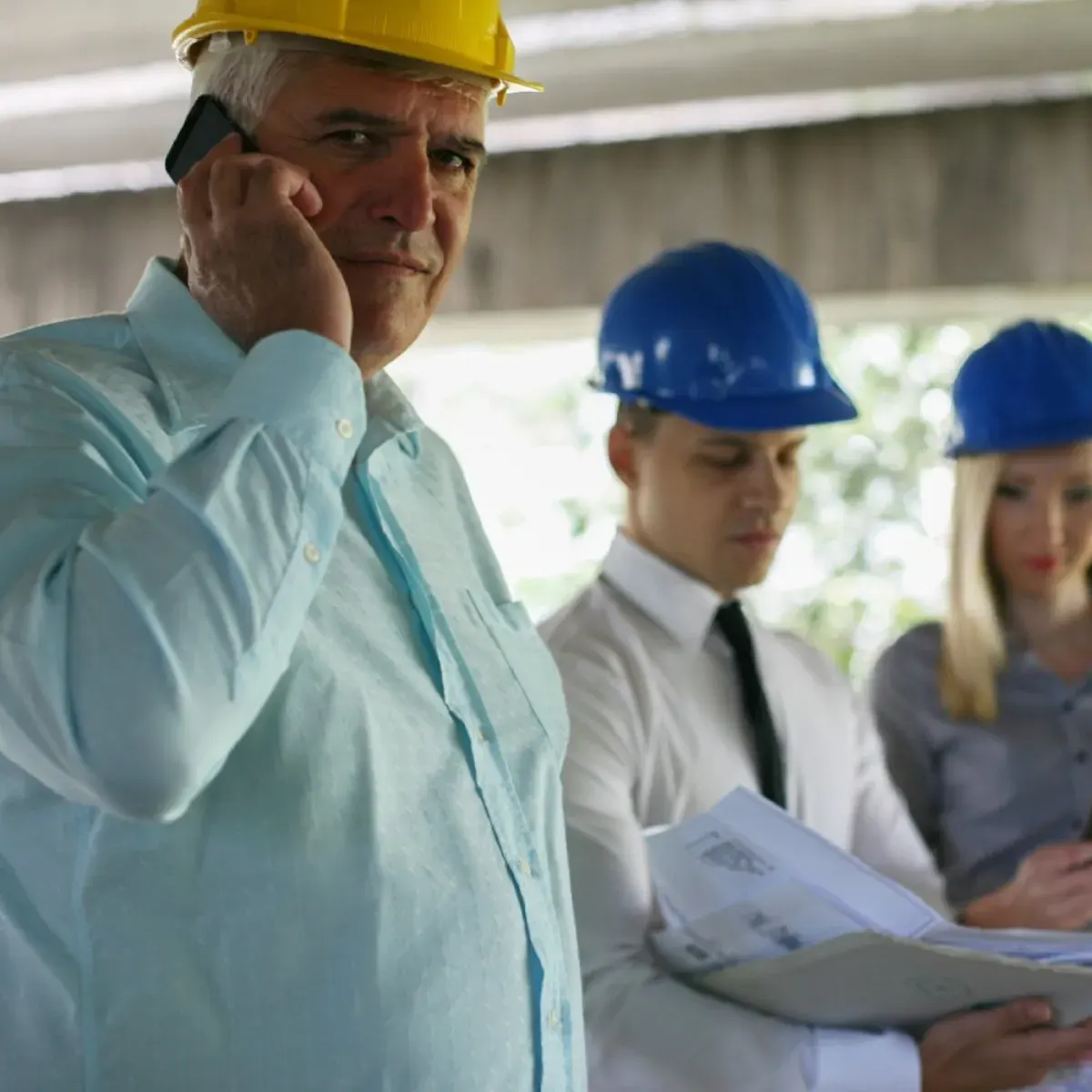Expert witness reviewing construction documentation to assess building defect claims