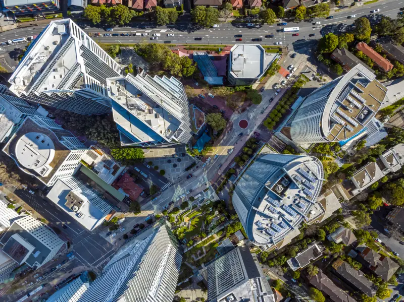 Inspector assessing a commercial building exterior during an insurance inspection in Australia