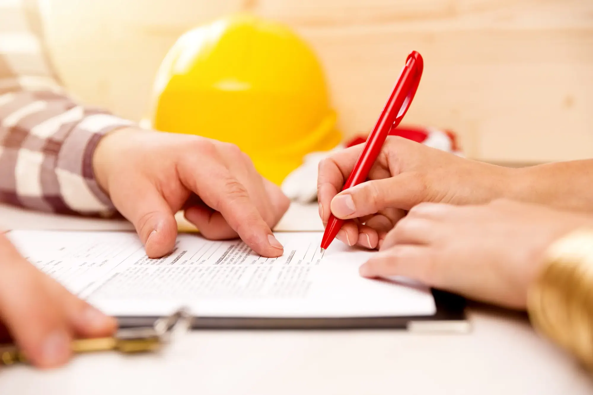 Building inspector presenting a defect report to property buyers in Australia