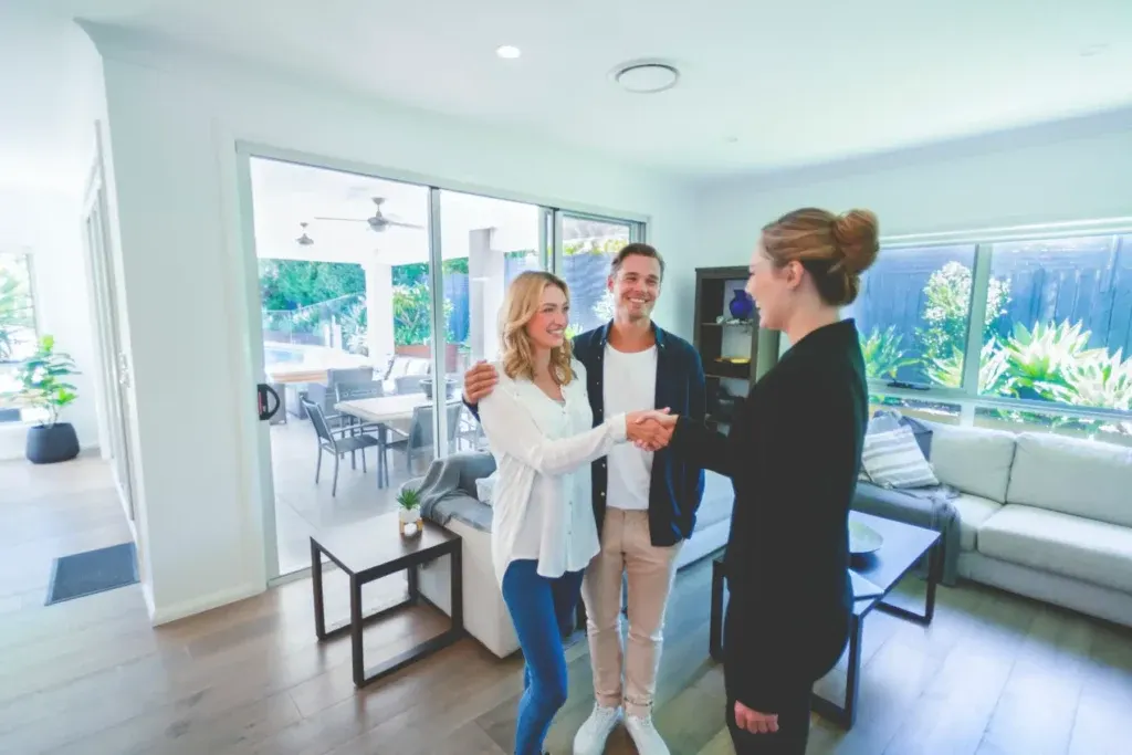 Couple talking to house agent about pre-sale property inspection