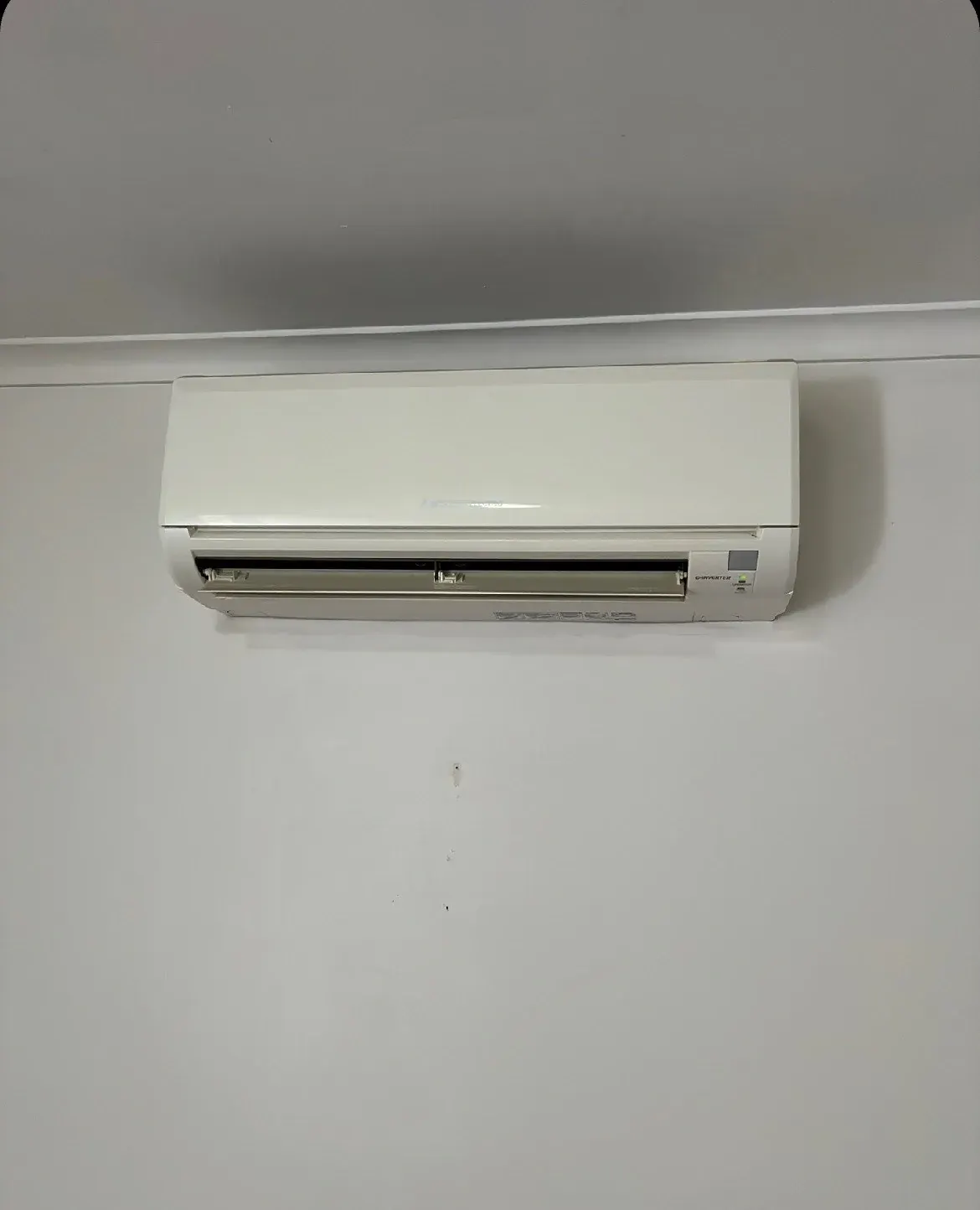 Fixed split system heater in a rental living area