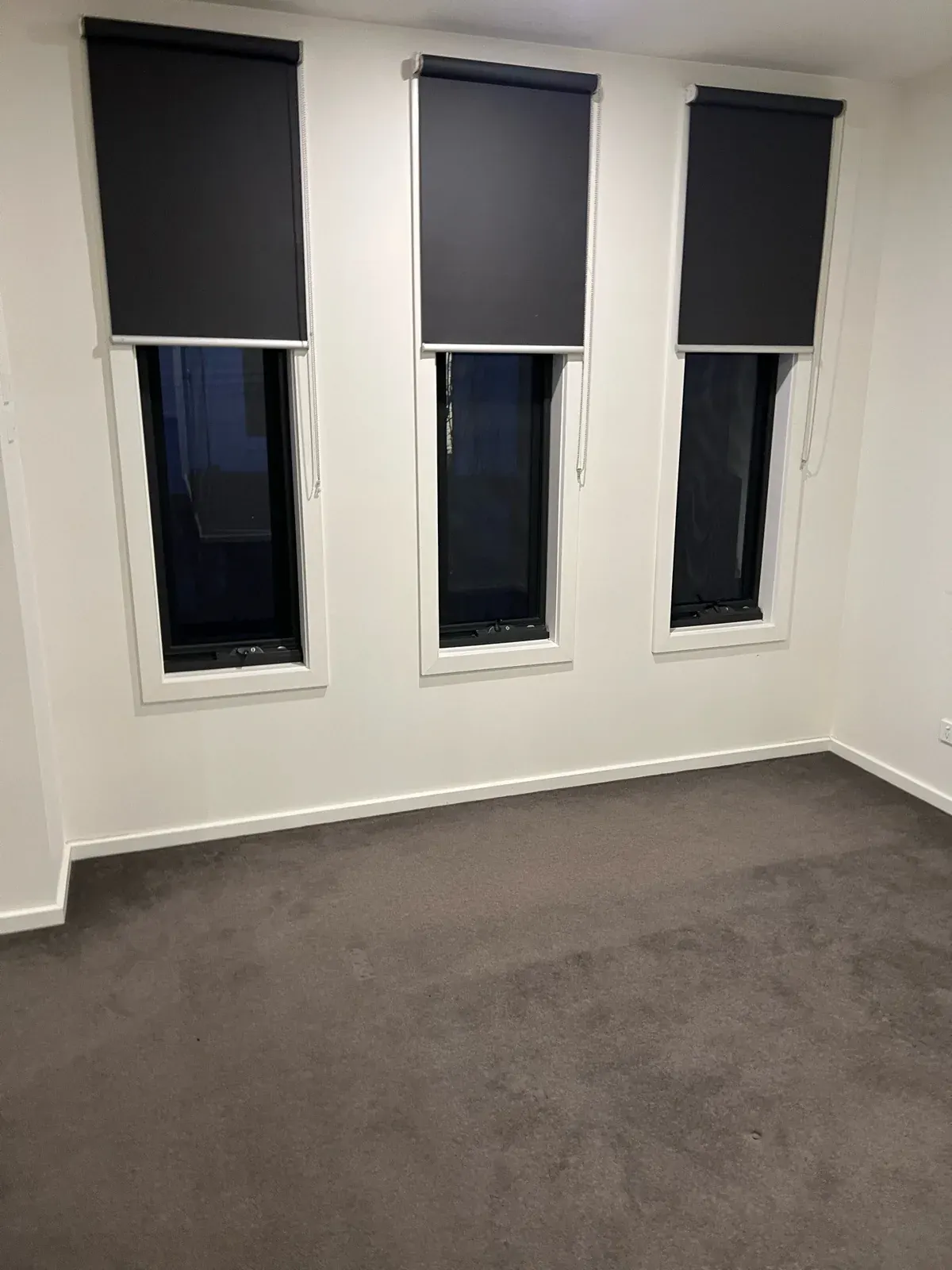 Rental bedroom with roller blinds checked for the window covering standard
