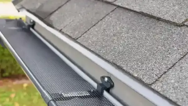 Professional roof inspector assessing tile roof on Brisbane home after storm season