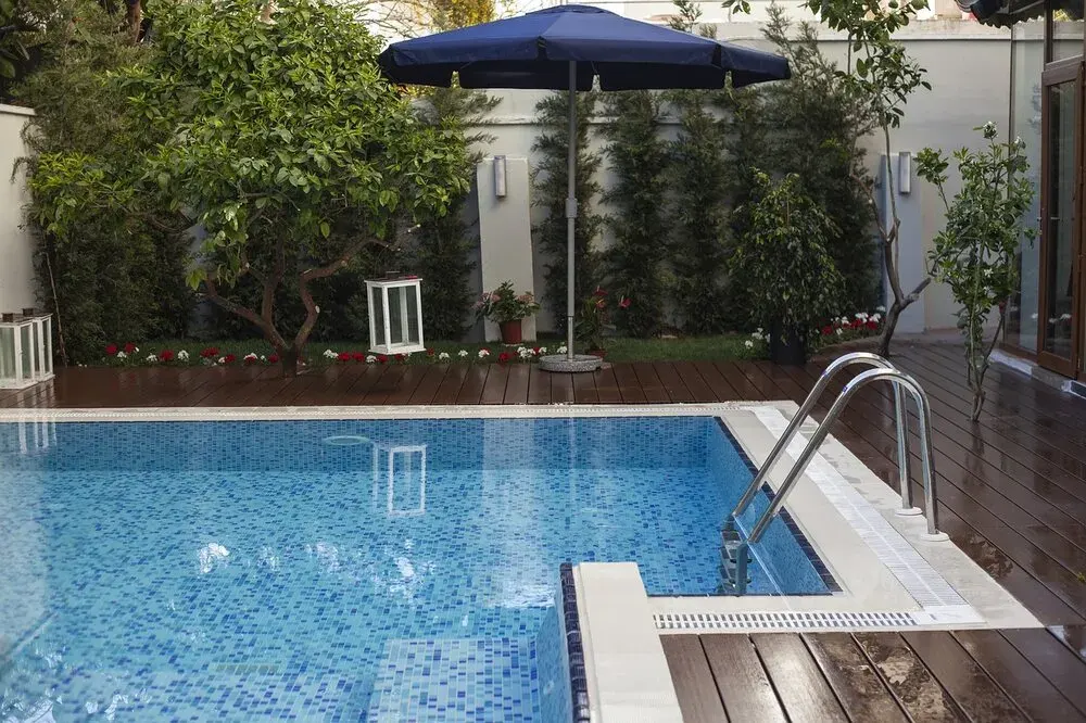 Australian backyard swimming pool being prepared for the winter season