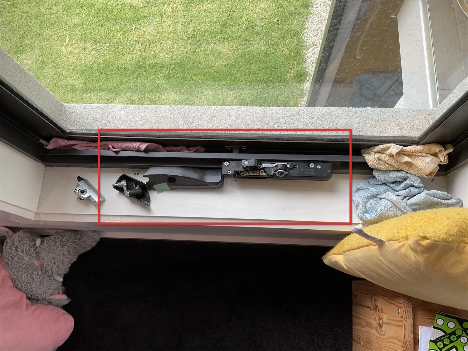 Sliding door hardware left partly disassembled with components sitting loose in the track, recorded at a pre-settlement inspection