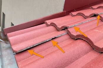 unaligned roof shingles, clearly indicating a roofing defect